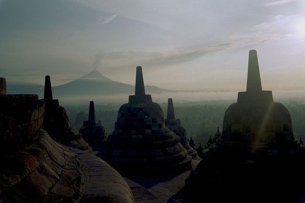 The Borobudur Buddhist Temple in Magelang, Central Java, Indonesia with Mount Merapi in the background. Image by ctsnow.